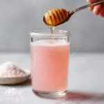 adding cayenne and honey to pink salt drink